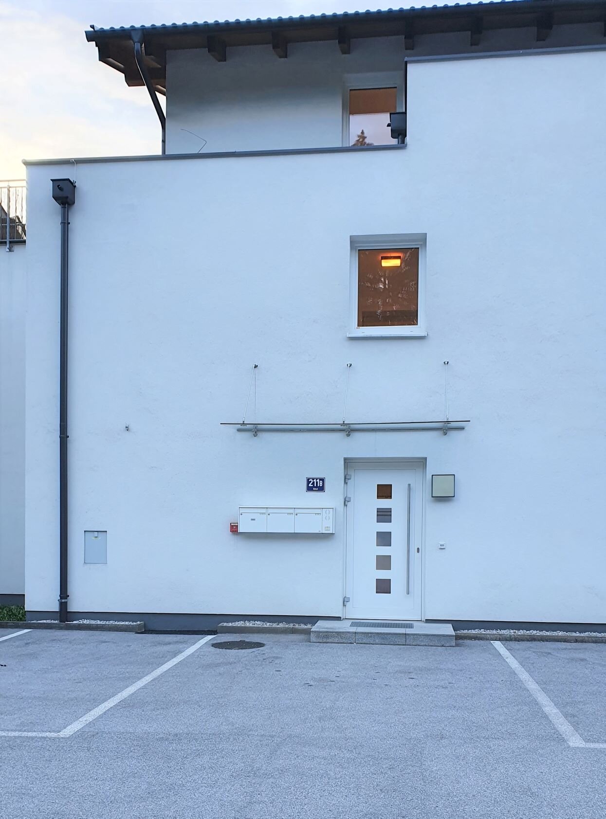 Parking spot to the left of front door