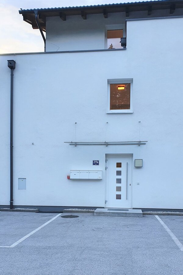 Parking spot to the left of front door